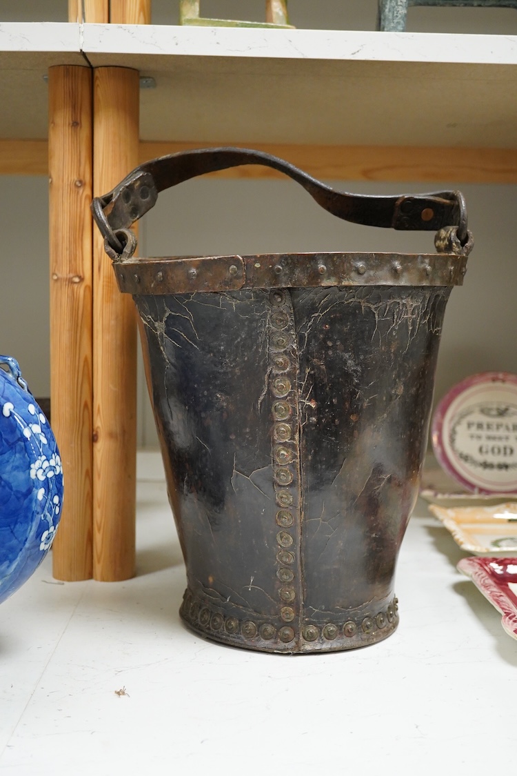 A 19th century leather fire bucket, 34cm high